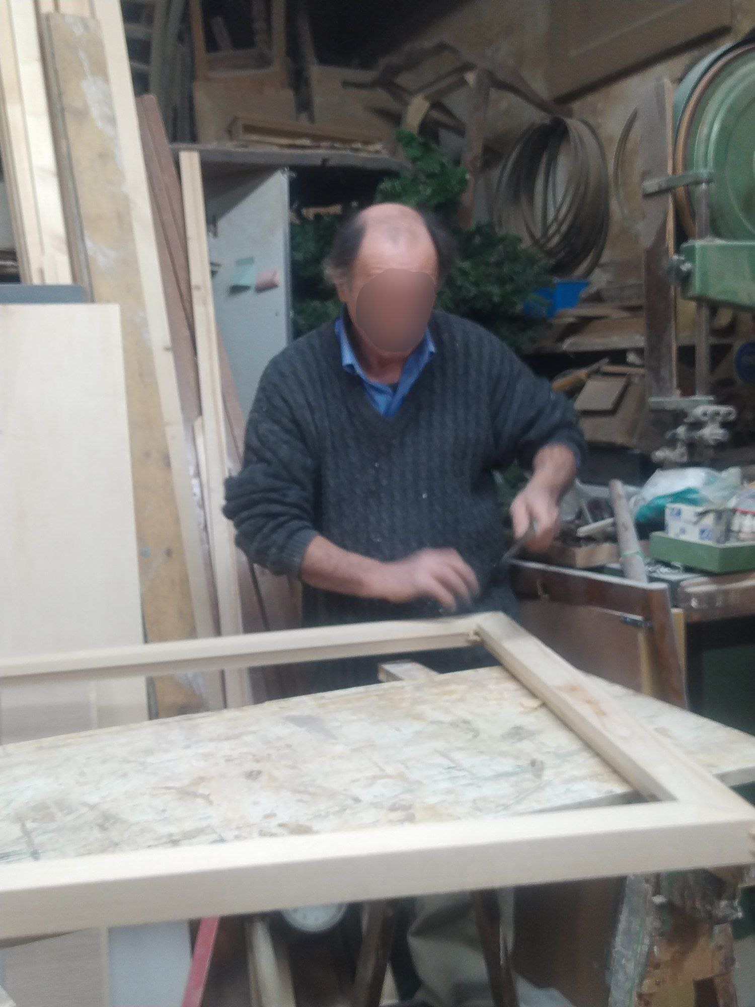 a man making a large piece of wood